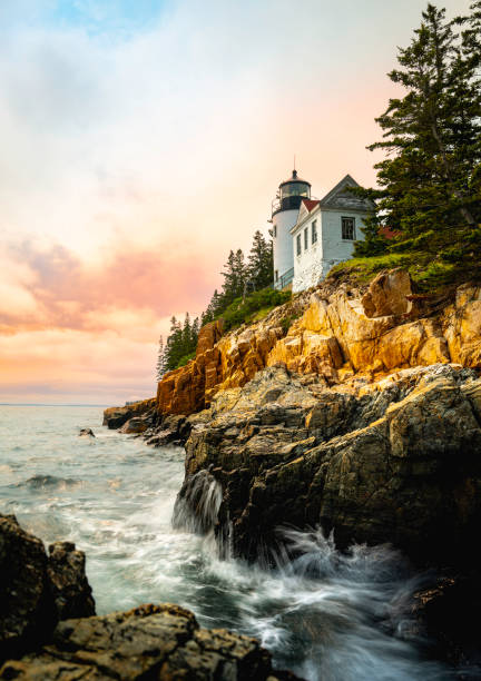 istock Sunset over the lighthouse on the cliff 1494415000