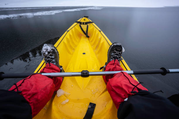 istock People in nature. Kayaking in winter, POV. 1494420619