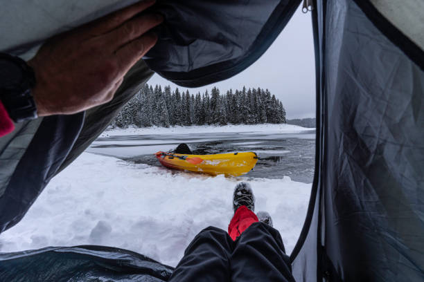 istock People in nature. Camping and kayaking in winter. POV 1494420648