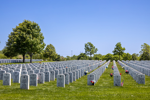 Minneapolis, Minnesota, USA - May 27, 2023: Landscape view of soldier gravestones at Fort Snelling National Cemetery on a clear day.