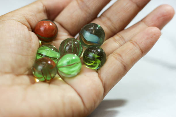 istock marble glass toy in palm. copy space. isolated. 1494425066