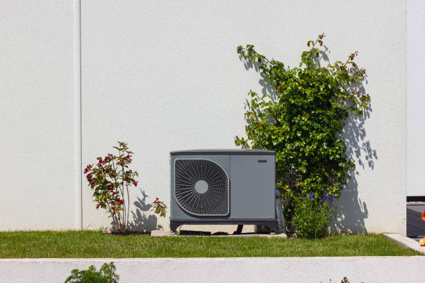 heat pump in a new building area with modern house facades stock photo