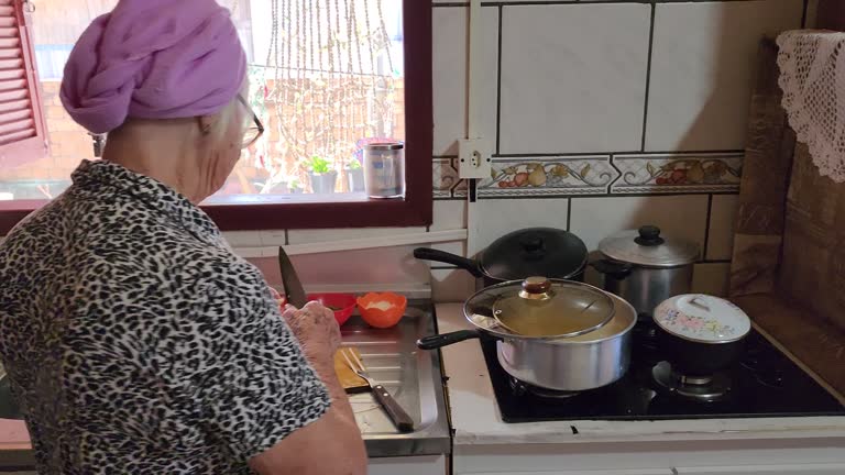 elderly woman cooking