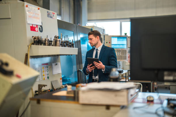 istock White Male Manager Using A Digital Tablet While Inspecting The Quality At A Factory 1494438958