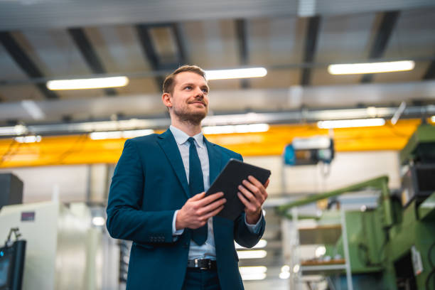 istock Successful Businessman In A Manufacturing Plant 1494439331
