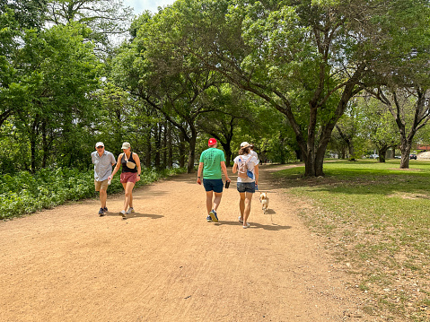 Austin , Texas , USA- April 2023 -  People walking on trails outdoors near Austin Downtown, Texas