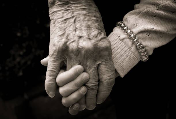 istock Grandmother and granddaughter hands 1494442399