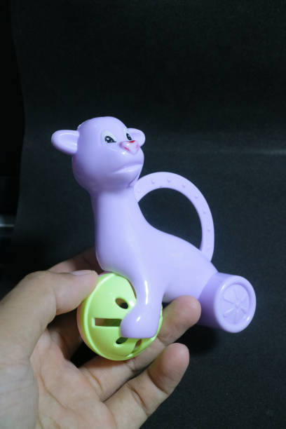 istock Cute purple alpaca toy holding a ball 1494442793