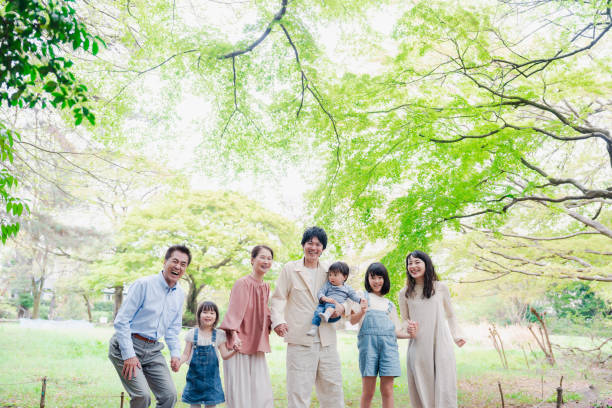 A three-generation family living happily with smiles on their faces