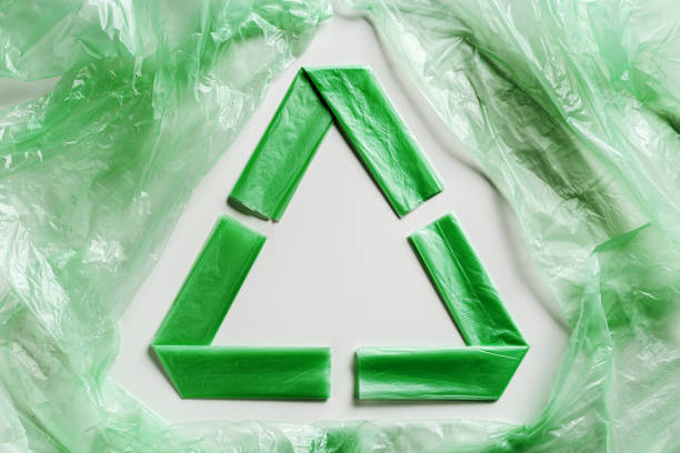 istock Recycling symbol made from green disposable plastic bags on white Waste reduction, Environmentally friendly, recycling concept. Pollution from Polyethylene packets, plastic bag free day 1494443257