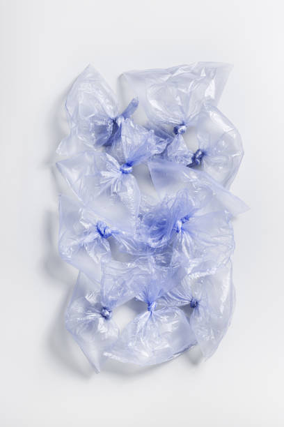 istock Plastic free, environmental protection concept. Empty used plastic bags as minimal aesthetic trend pattern. Flat lay many blue disposable polyethylene packet. Plastic bag free day 1494443269