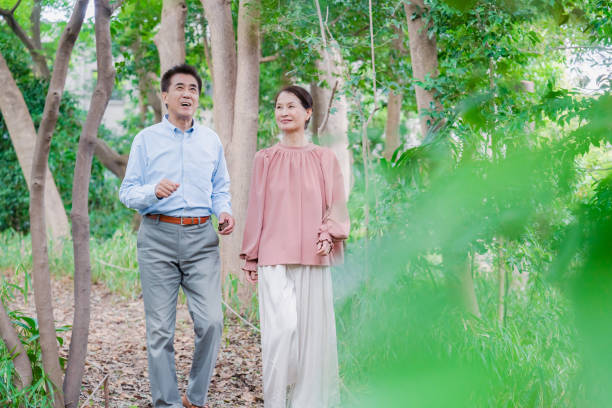istock A senior couple taking a walk in nature 1494444132