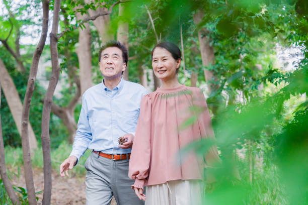 istock A senior couple taking a walk in nature 1494444163