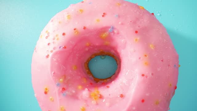 Beautiful pink donuts. Close-up macro video. 4K