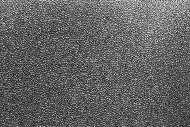 Black leather and a textured background.