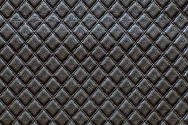 Black leather and a textured background.
