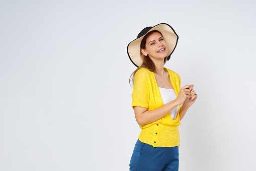 Young  woman in colorful clothes and sun hat, isolated over white background.Lifestyle summer concept.