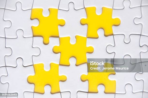 Top View Of Missing Jigsaw Puzzle With Customizable Space For Text Copy Space With Yellow Background Stock Photo - Download Image Now