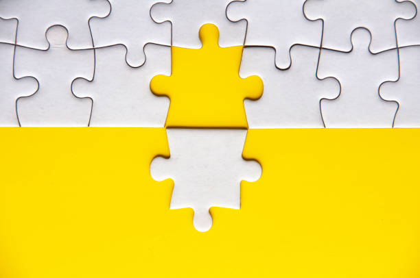 istock Separated jigsaw puzzle with customizable space for text. Copy space with yellow background 1494463630