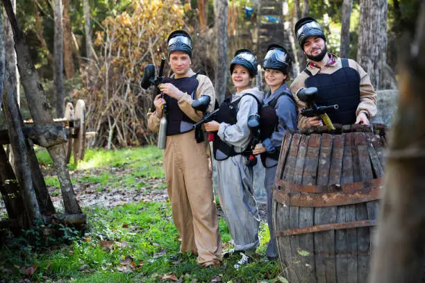 Photo of Friends posing on paintball field