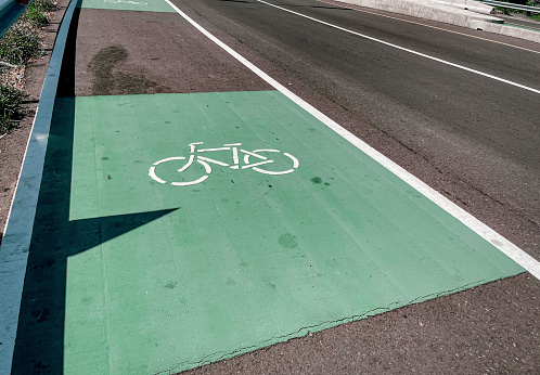 Bike lane sign and turn lane sign on highway