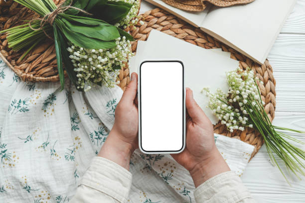 istock Phone with isolated screen, place for your congratulations, spring decor 1494477783