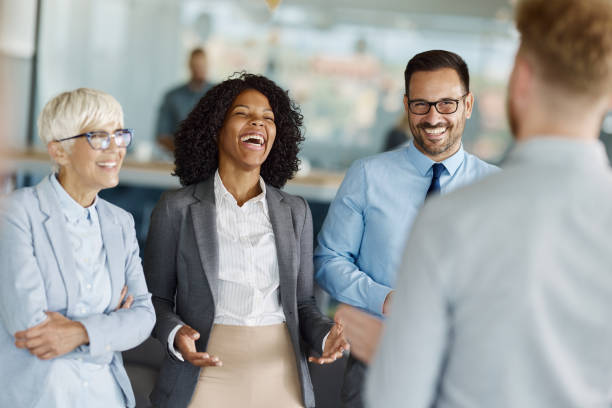 istock Cheerful business colleagues talking in a casual office. 1494479505