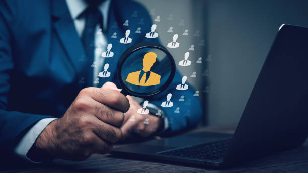 istock Magnifier glass focus looking for employee represented by icon. Human Resources HR management. 1494480582