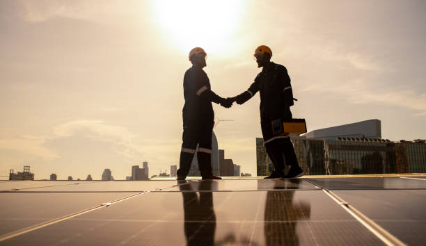 istock Engineers walking on roof inspect check and maintenance solar cell panel by hold equipment and cordless drill ,solar cell is smart grid ecology energy sunlight alternative power factory concept 1494483267
