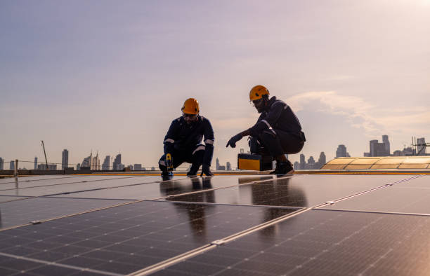 istock Engineers walking on roof inspect check and maintenance solar cell panel by hold equipment and cordless drill ,solar cell is smart grid ecology energy sunlight alternative power factory concept 1494483327