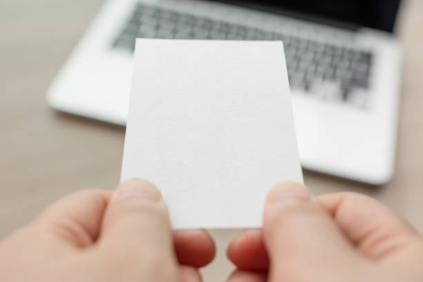 istock Passing vertical business cards during meetings. blank card, mockup 1494483560