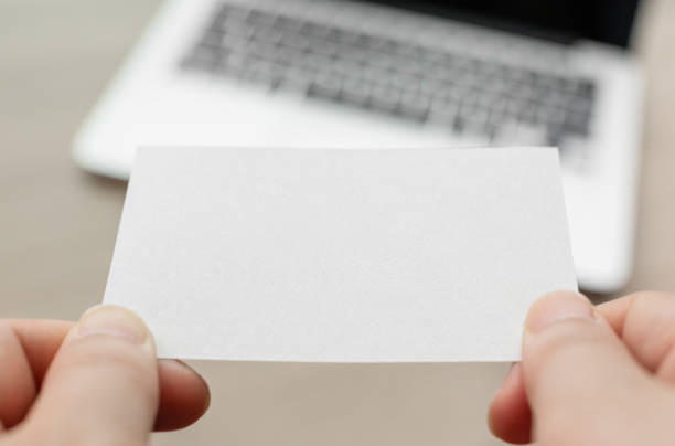 istock Pass horizontal business cards during meetings. blank card, mockup 1494483600