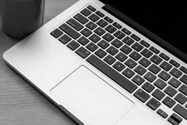 istock A laptop and a cup are placed on the table. meeting time 1494483656