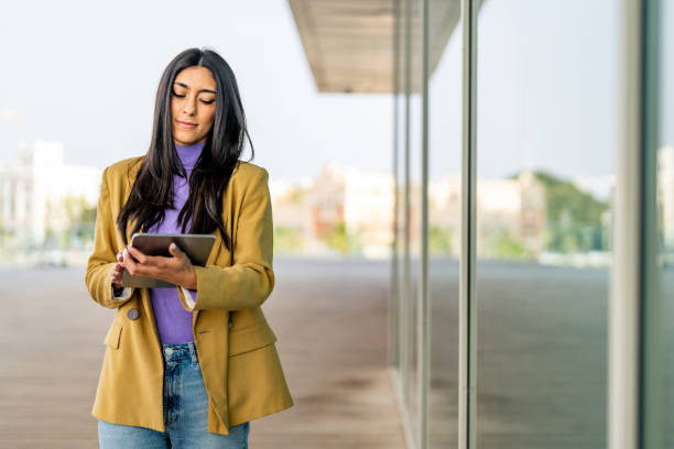 istock Woman working and using technology in the city 1494483824