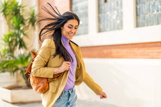 istock Young woman rushing to work 1494484136