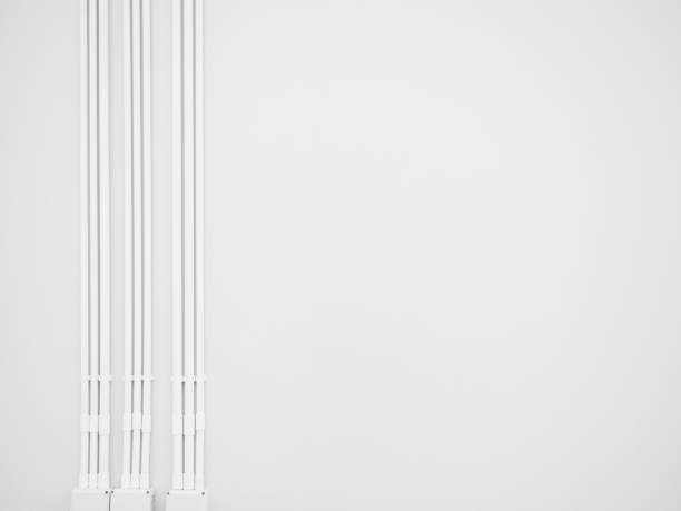 Conduit Corrugated Junction Box Pipe Steel Pvc Galvenized Connection on White Wall Cement Concrete,Wiring Metal Technology  Line House Energy on Construction Concrete Architecture Floor,Cable Network.