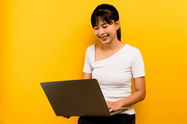 istock working with laptop working online communicating online thinking good job ideas work from home young women work and enjoy working 1494485343