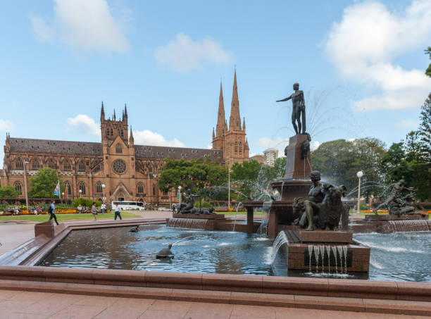 Hyde Park Fountain and St Mary's Cathedral in Sydney, Australia Sydney, Australia - November 10, 2014: Hyde Park Fountain and St Mary's Cathedral in Sydney, Australia hyde park flowers stock pictures, royalty-free photos & images