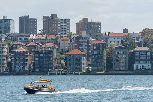 Sydney, Australia - November 5, 2014: Sydney Business Architecture. Harbour with Yellow Water Taxi.