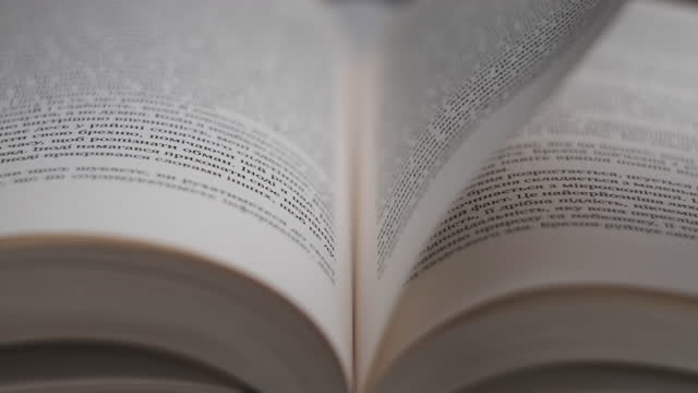 Turning Pages of a Book, Close-Up, Slow Motion