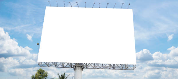 istock Blank white billboard with room to add your own text, background with white clouds and blue sky for outdoor advertising, banner 1494489640