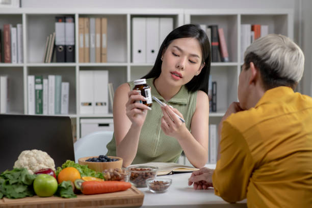 istock Nutritionist with woman client 1494492888