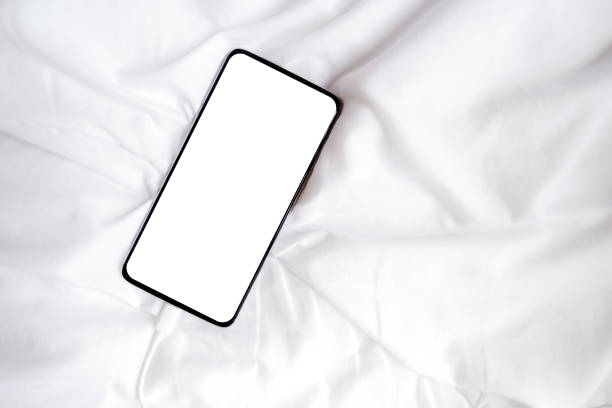 istock White blank screen smartphone for inserting pictures or advertising text on white fabric. Clipping path. Copy space. 1494492972