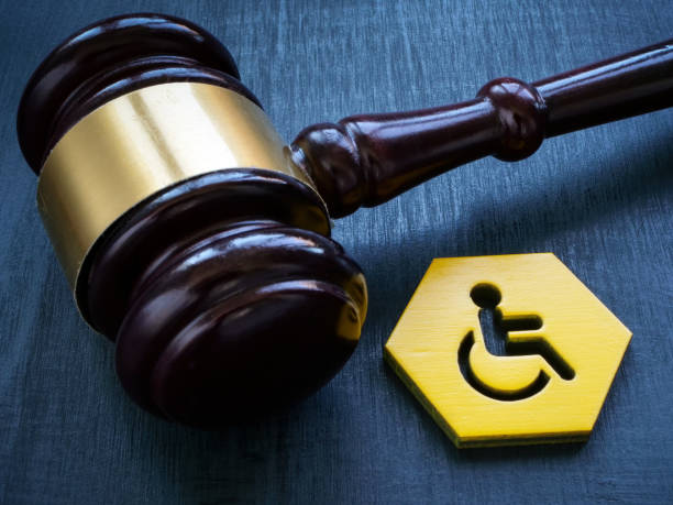 Gavel as symbol of law and disability person sign. stock photo