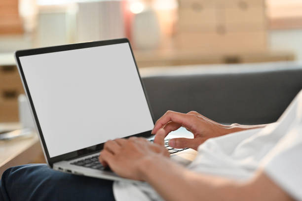 istock Close up view man working remotely online, browsing internet on laptop at home. 1494498348