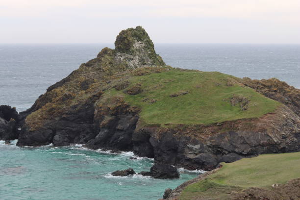 istock Kynance Cove, Cornwall, against a turquoise blue sea 1494499886