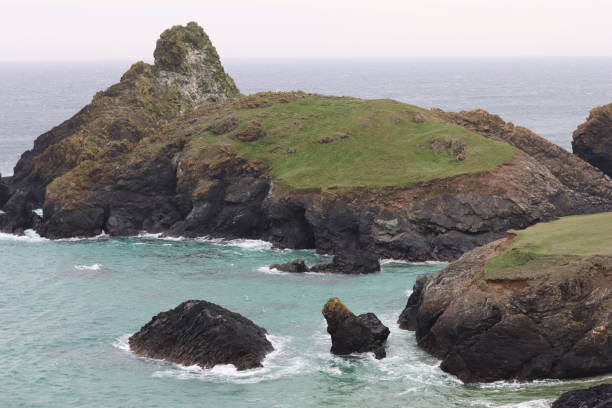 istock Kynance Cove, Cornwall, against a turquoise blue sea 1494499977