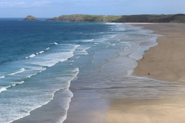 istock Long sandy coastline with breaking waves and a deep turquoise blue sea in sunshine 1494501144