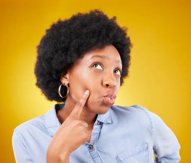 istock Doubt, thinking and black woman with decision, opportunity and ideas against a studio background. African American female, lady and thoughtful with wonder, daydreaming and brainstorming with thoughts 1494501191