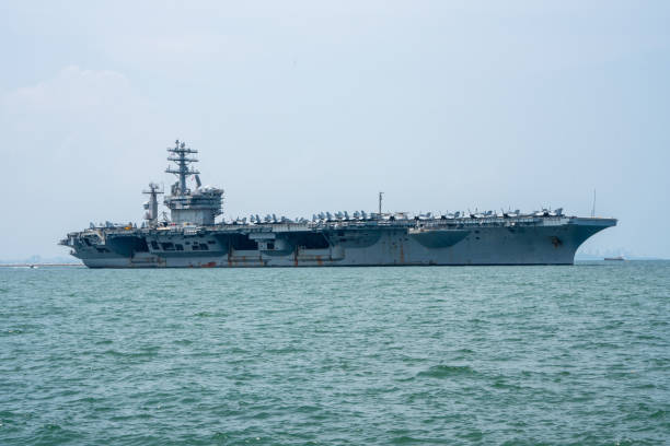 istock Nuclear War Ship, Military navy ship carrier full loading fighter jet aircraft for prepare troops. forwarder mast. Side view of War Ship. 1494509004